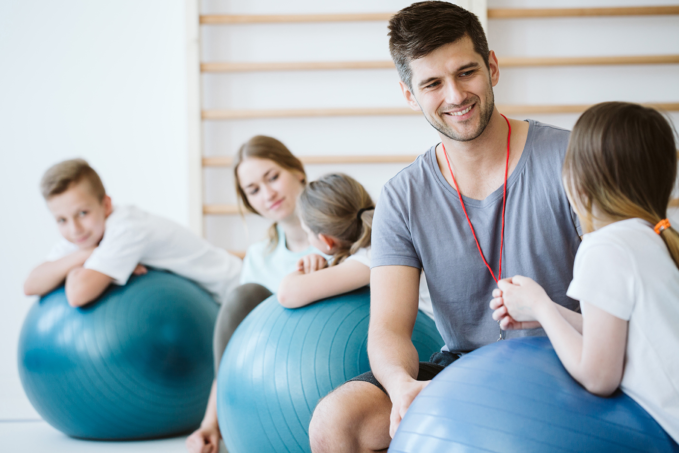 Trainers watching over the kids during physical education classes